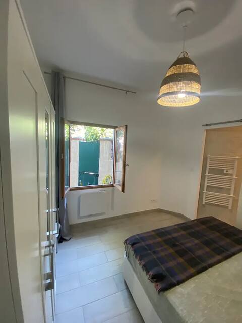 Bedroom with double bed and open window